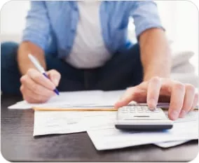 Photo of a man doing financial paperwork
