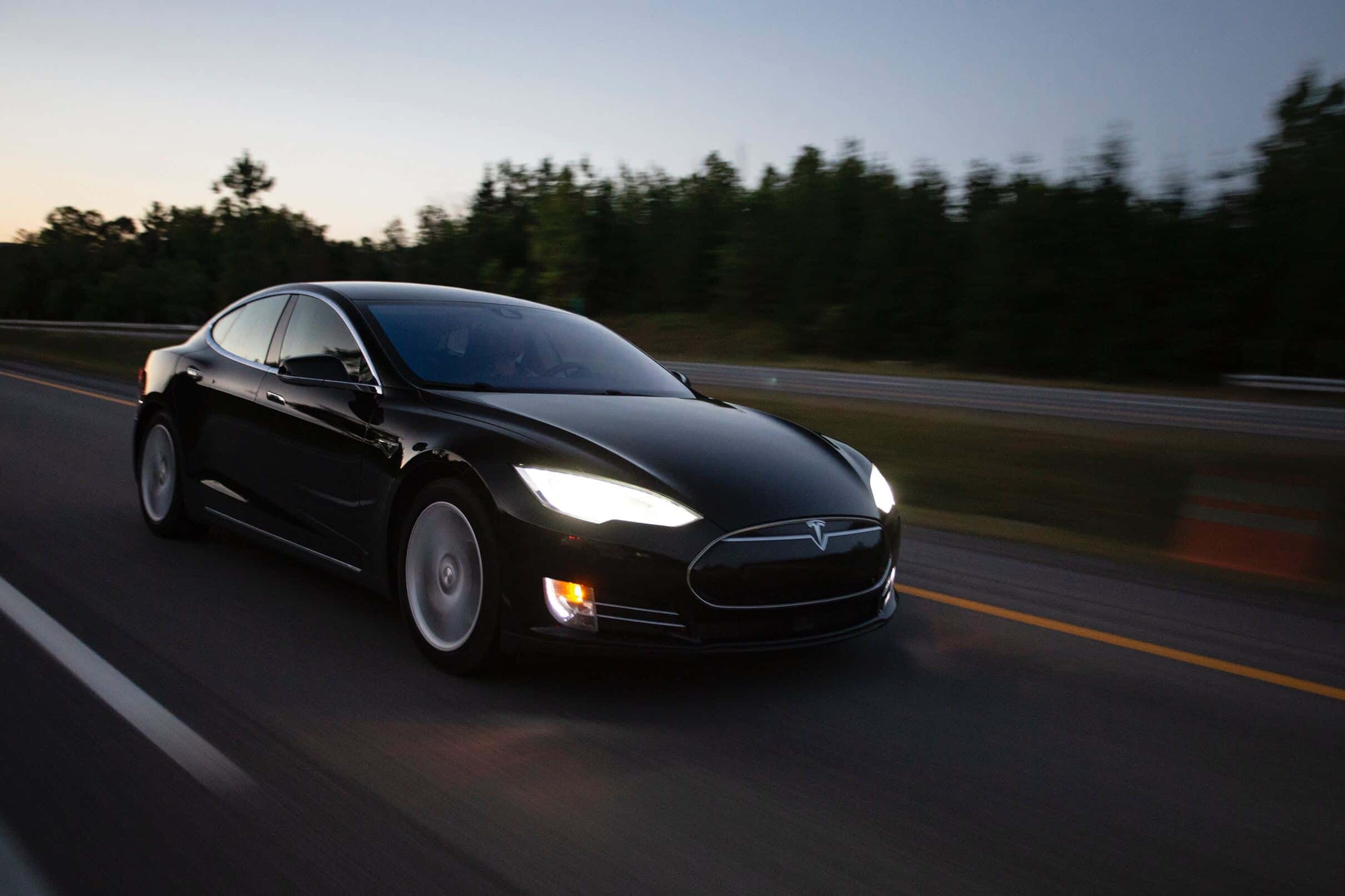 Tesla Model S: A black Tesla Model S in a pristine urban environment, exemplifying the perfect harmony of luxury and electric power.