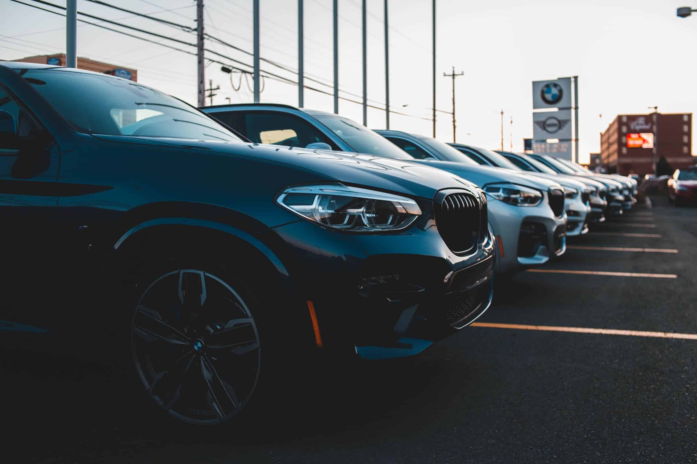 A thriving car dealership with a diverse selection of vehicles on display.