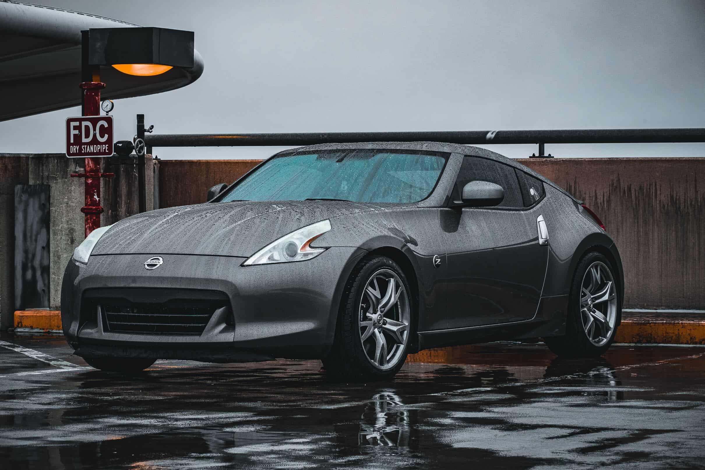 Red Nissan 370Z on open road