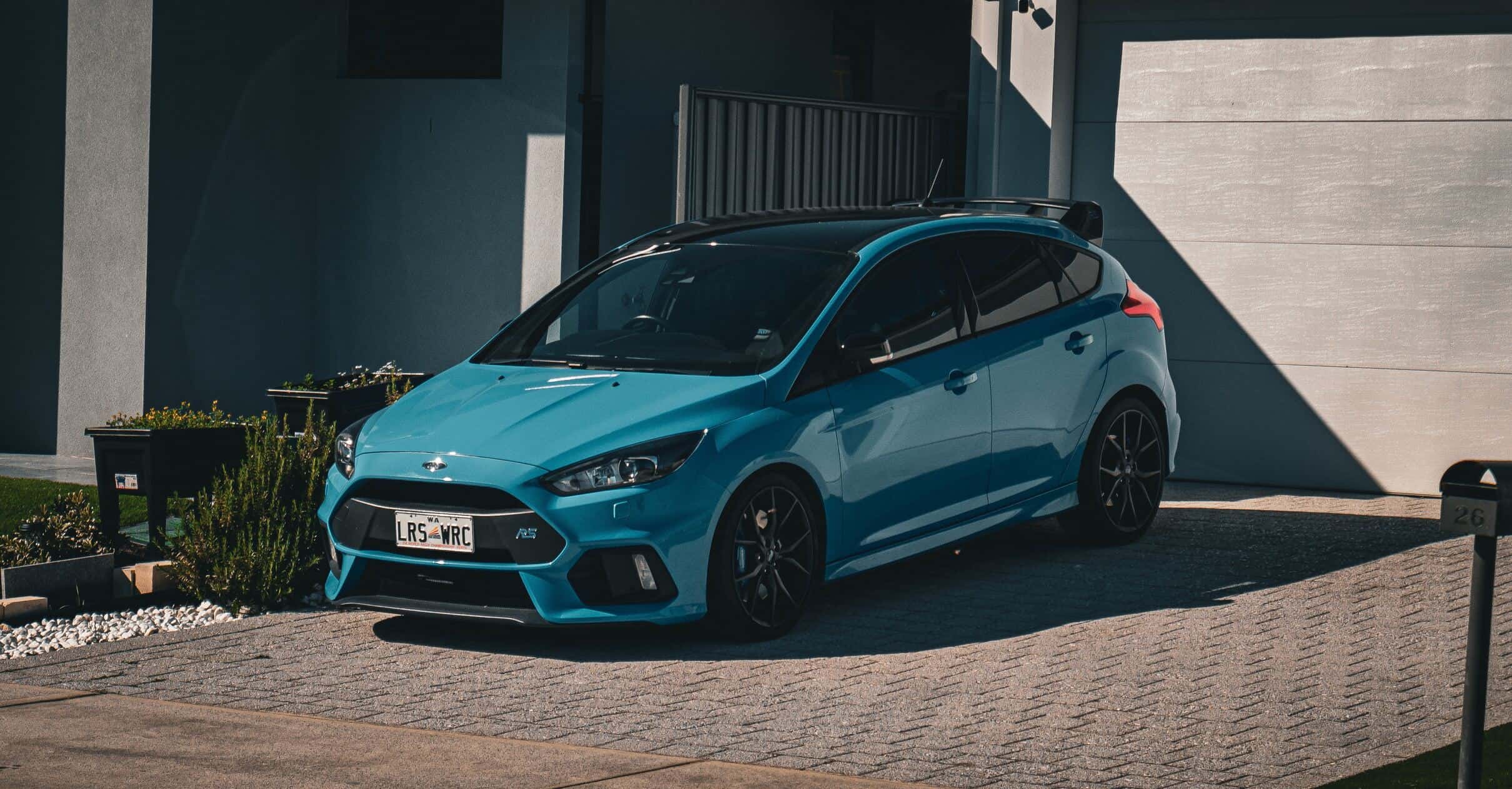 Blue Ford Focus RS parked on a road